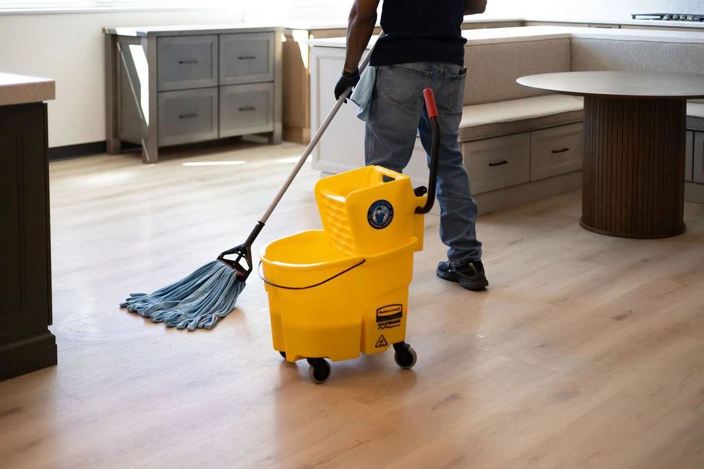 Mop and bucket in use on a commercial hard floor