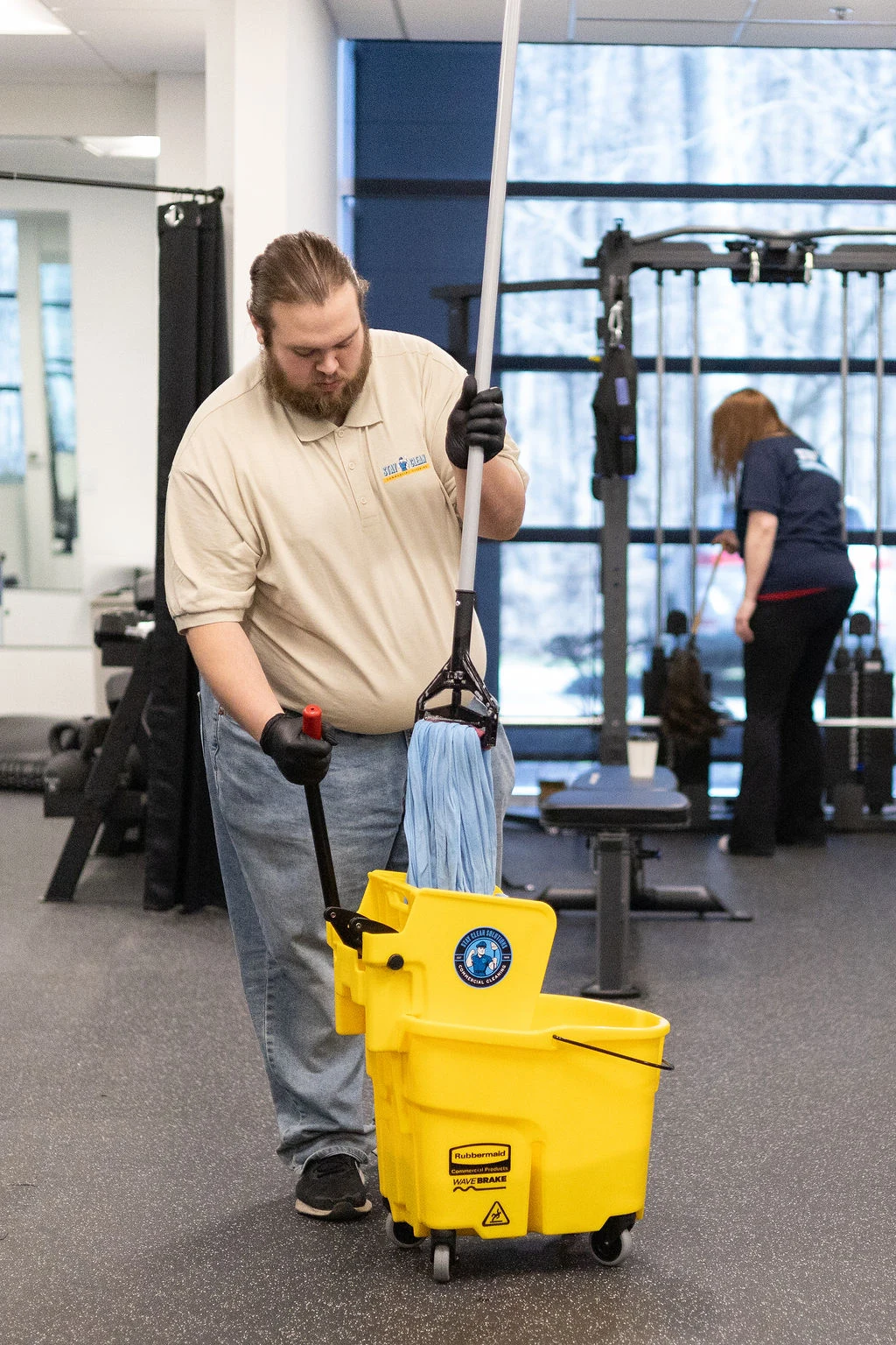 Stay Clean crew servicing a commercial fitness facility